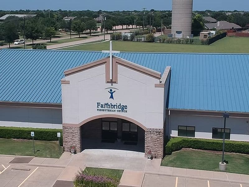 Faithbridge Presbyterian Church entrance with modern design and blue metal roof.