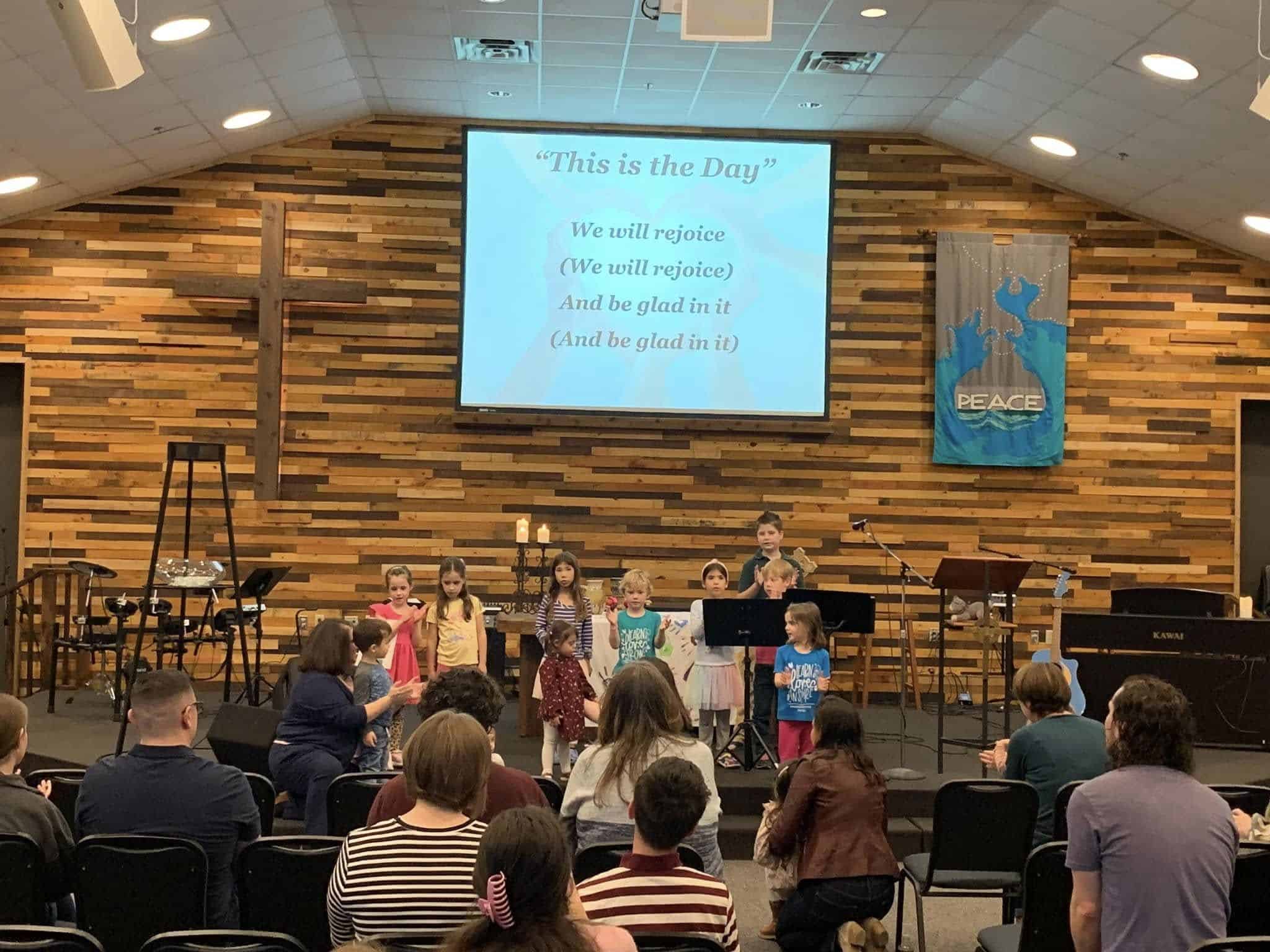 Children performing on stage at Faithbridge Presbyterian Church worship service.